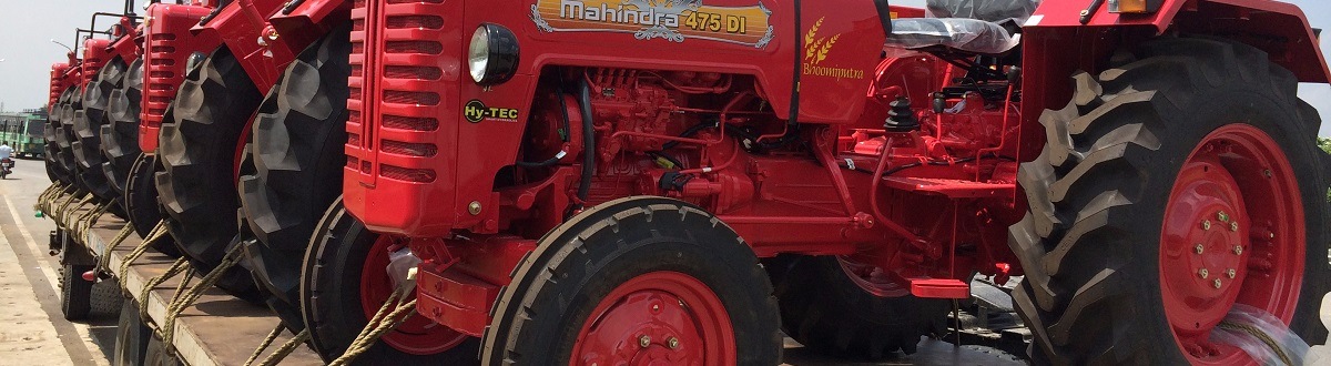 Mahindra Tractors being transported. Of Anderson Feed & Hardware at 88 Millies Pl. 